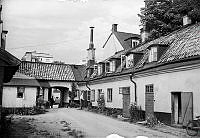 Vy mot norr över gårdsinteriör på Brännkyrkogatan 117. I fonden Lundagatan och kvarteret Marmorn.