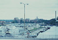 Vy österut från Skanstullsbron över Hammarby sjö och Norra Hammarbyhamnen. I fonden punkthusen på Danviksklippan.