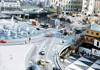 Vy mot sydost från Sergels Torg 14 över del av Sergels Totg och fontänen mot kvarteren Fyrmörsaren, Åskslaget och Trollhättan som är under rivning.