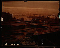 Ombyggnation av Slussen. Vy över västra delen med Gamla Stan och Stadshuset i bakgrunden.